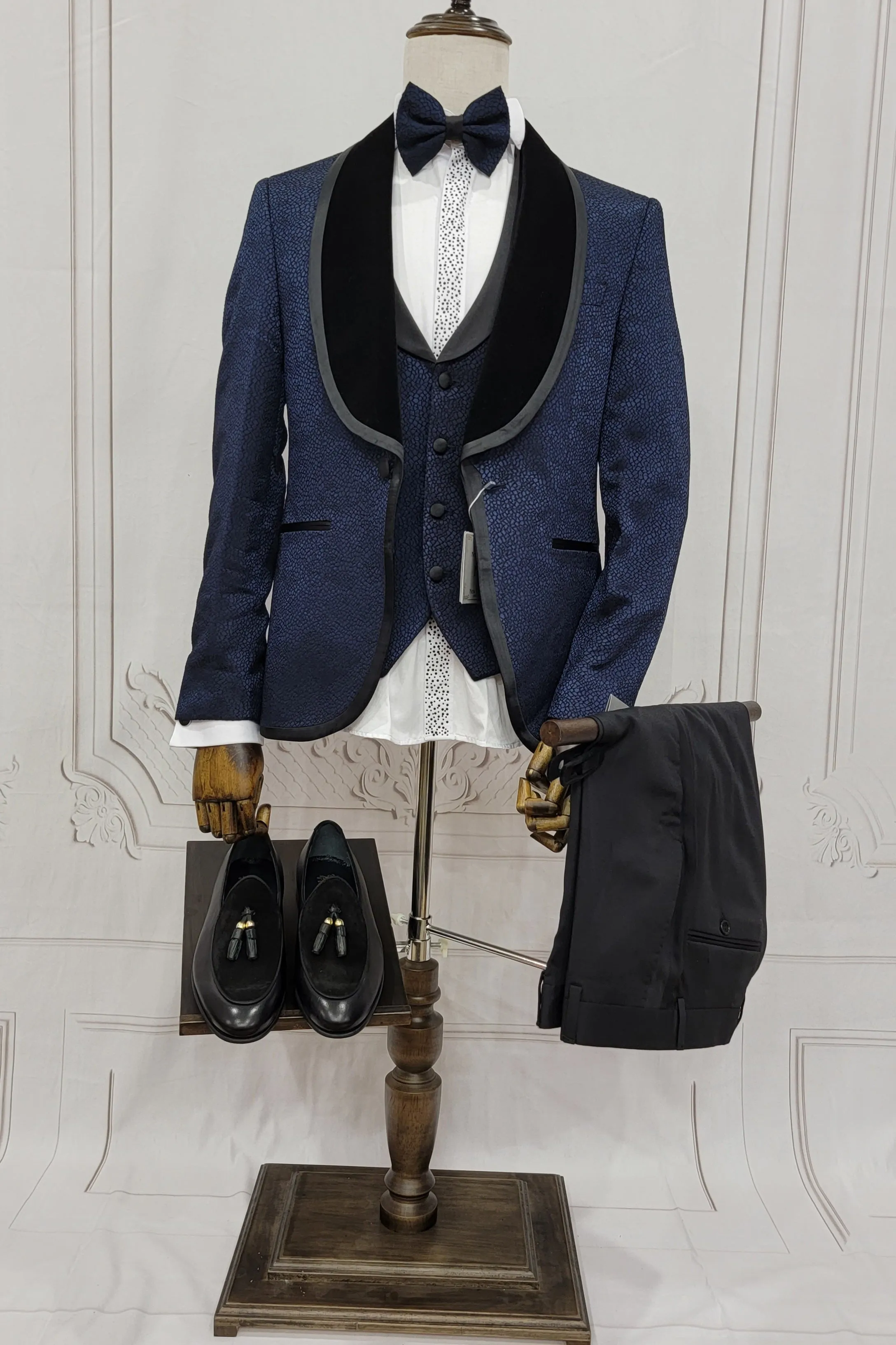 Single button three piece men's Suit with contrasting black velvet lapel, matching bow tie and Black Pants