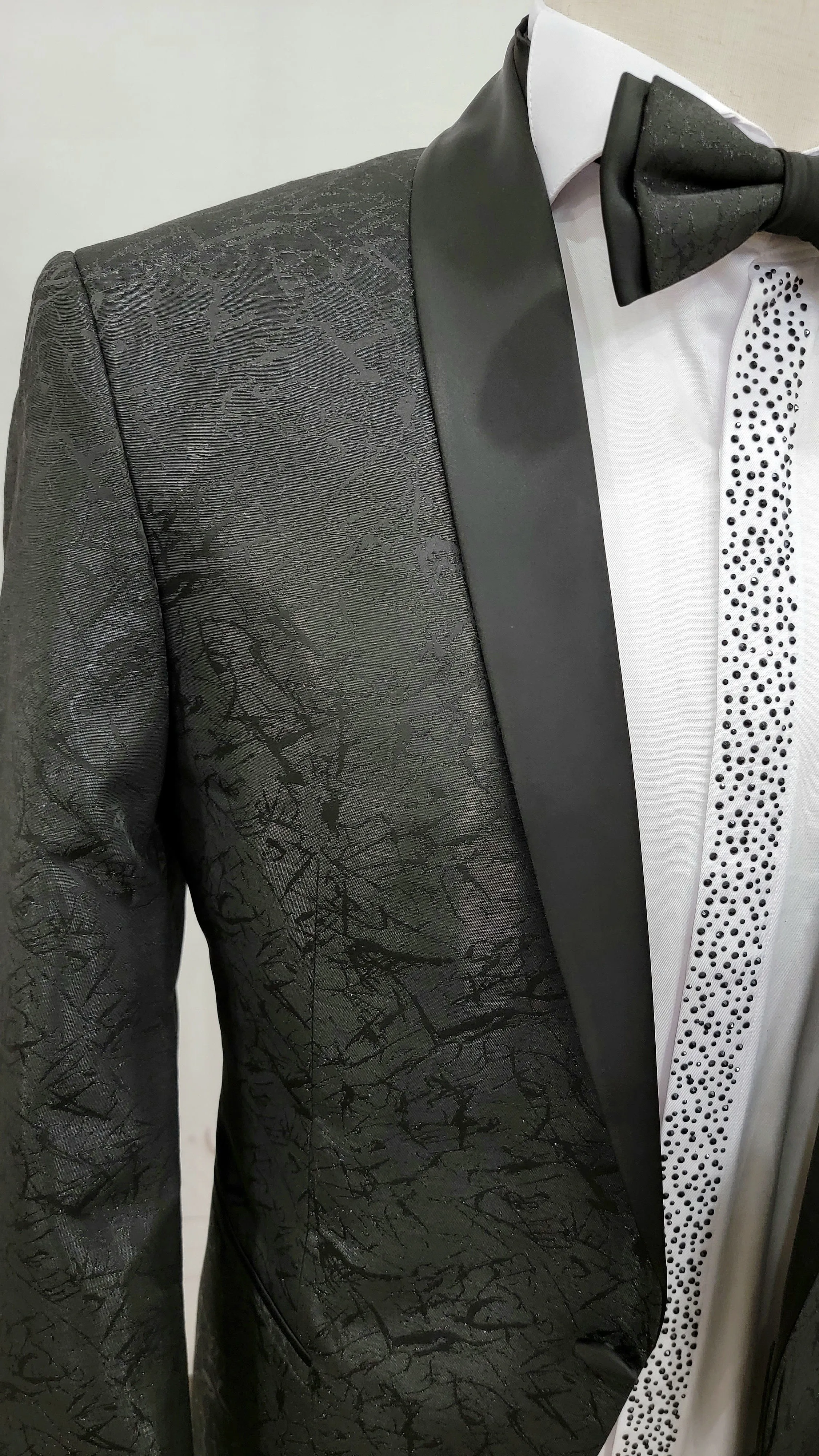 Single Button Two-Piece Tuxedo Suit with matching bow tie and Black Pants.