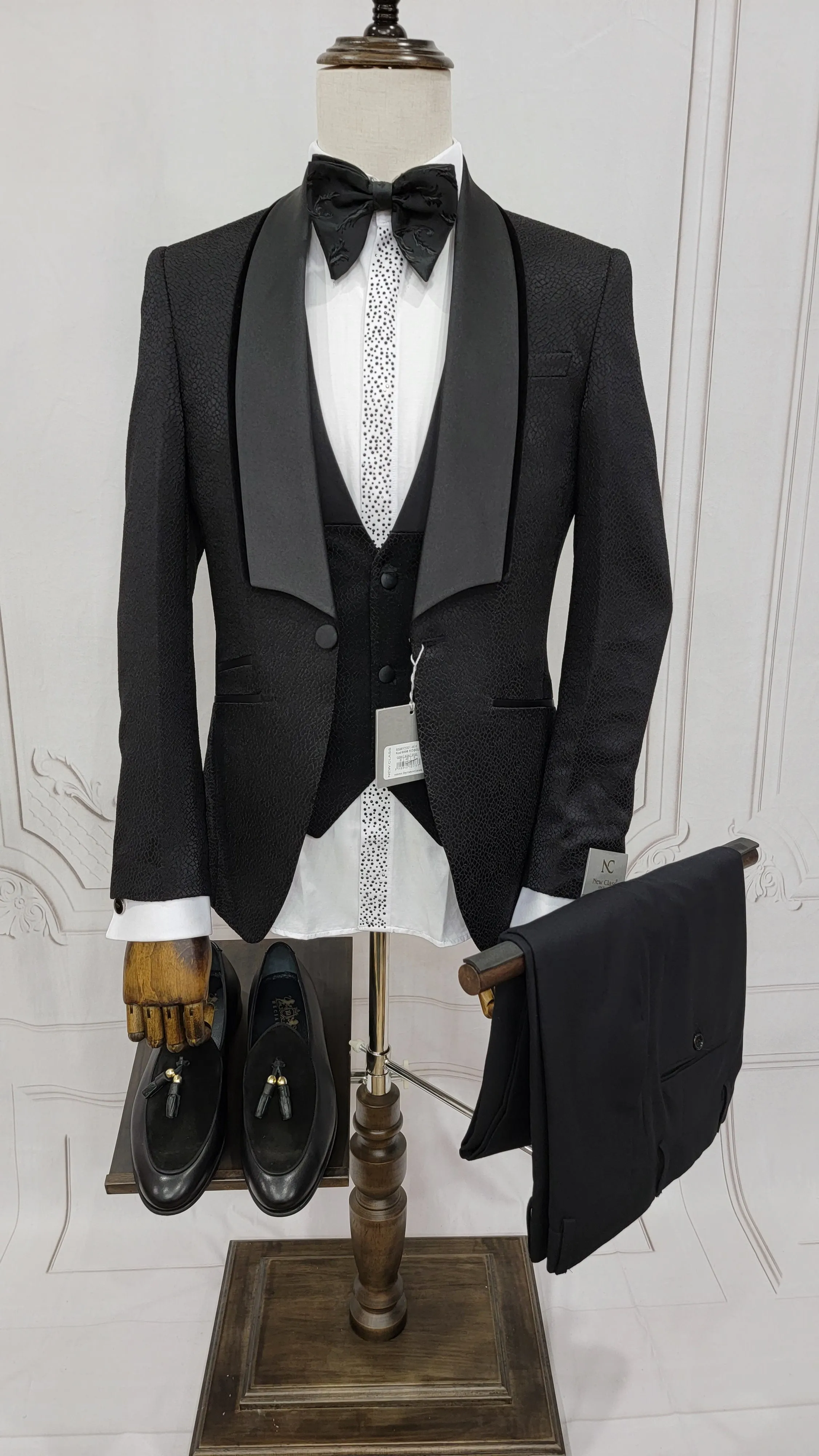 Three Piece Tuxedo Suit with Black velvet accented Lapel and Pants.