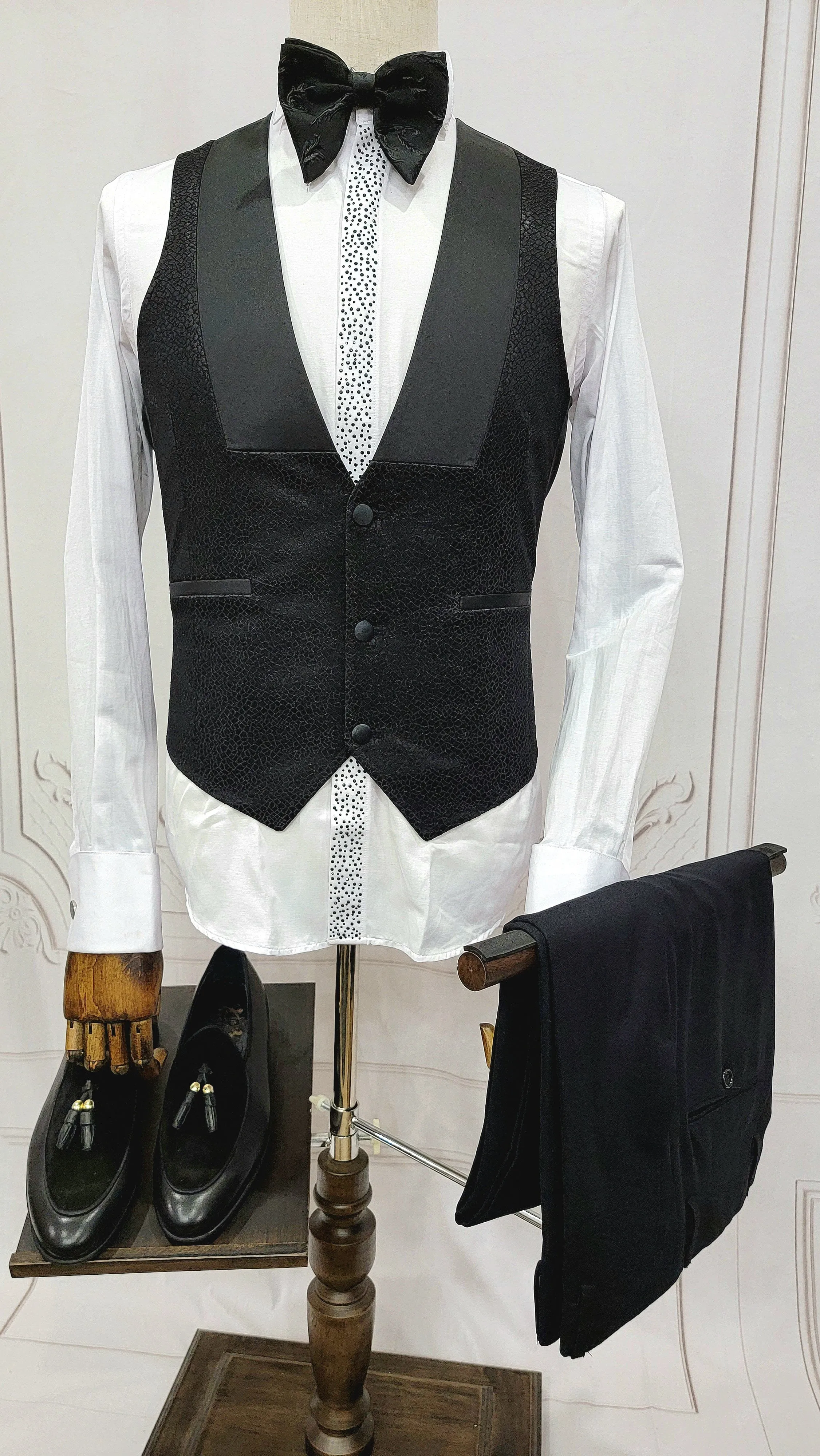 Three Piece Tuxedo Suit with Black velvet accented Lapel and Pants.