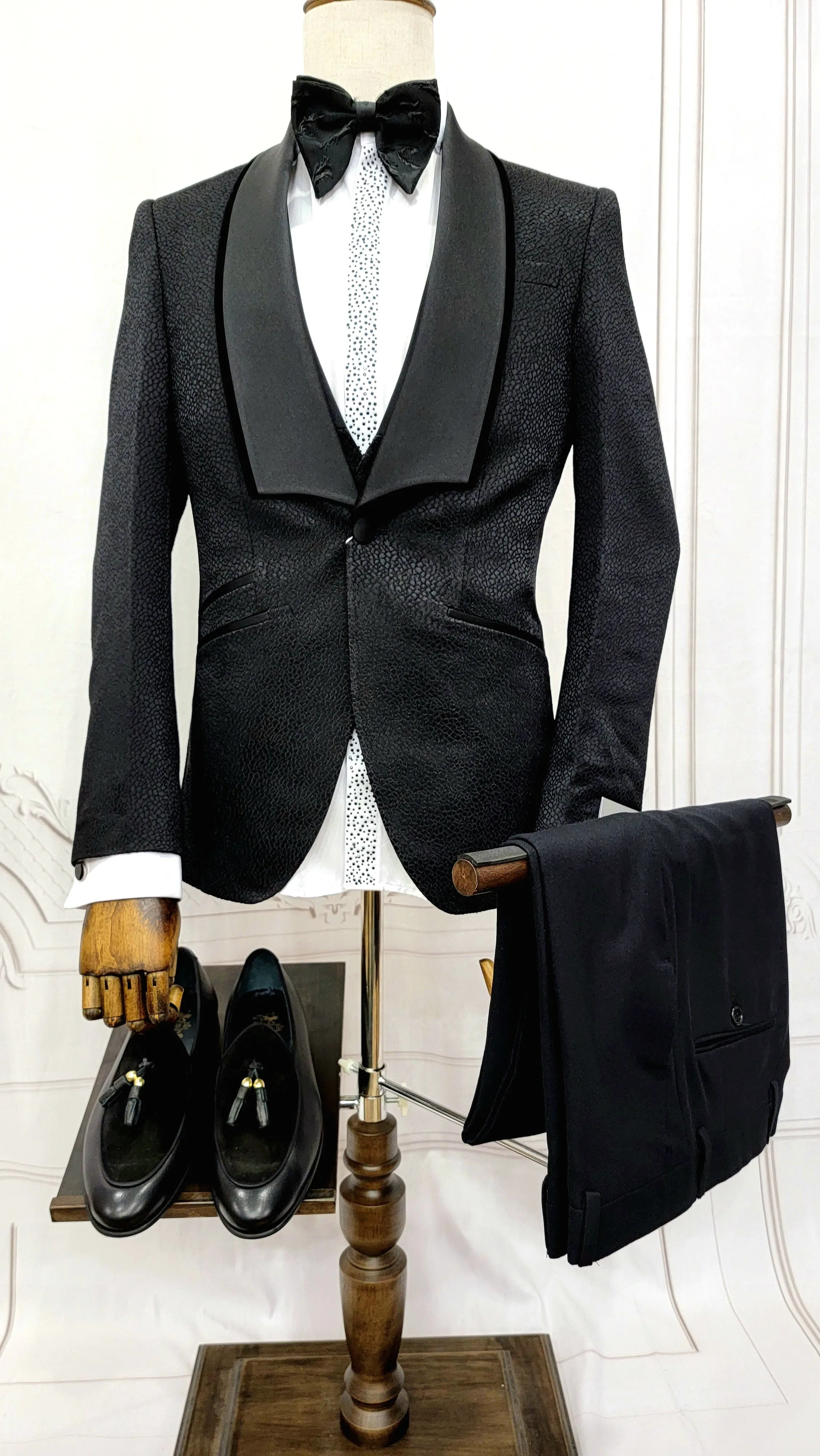 Three Piece Tuxedo Suit with Black velvet accented Lapel and Pants.