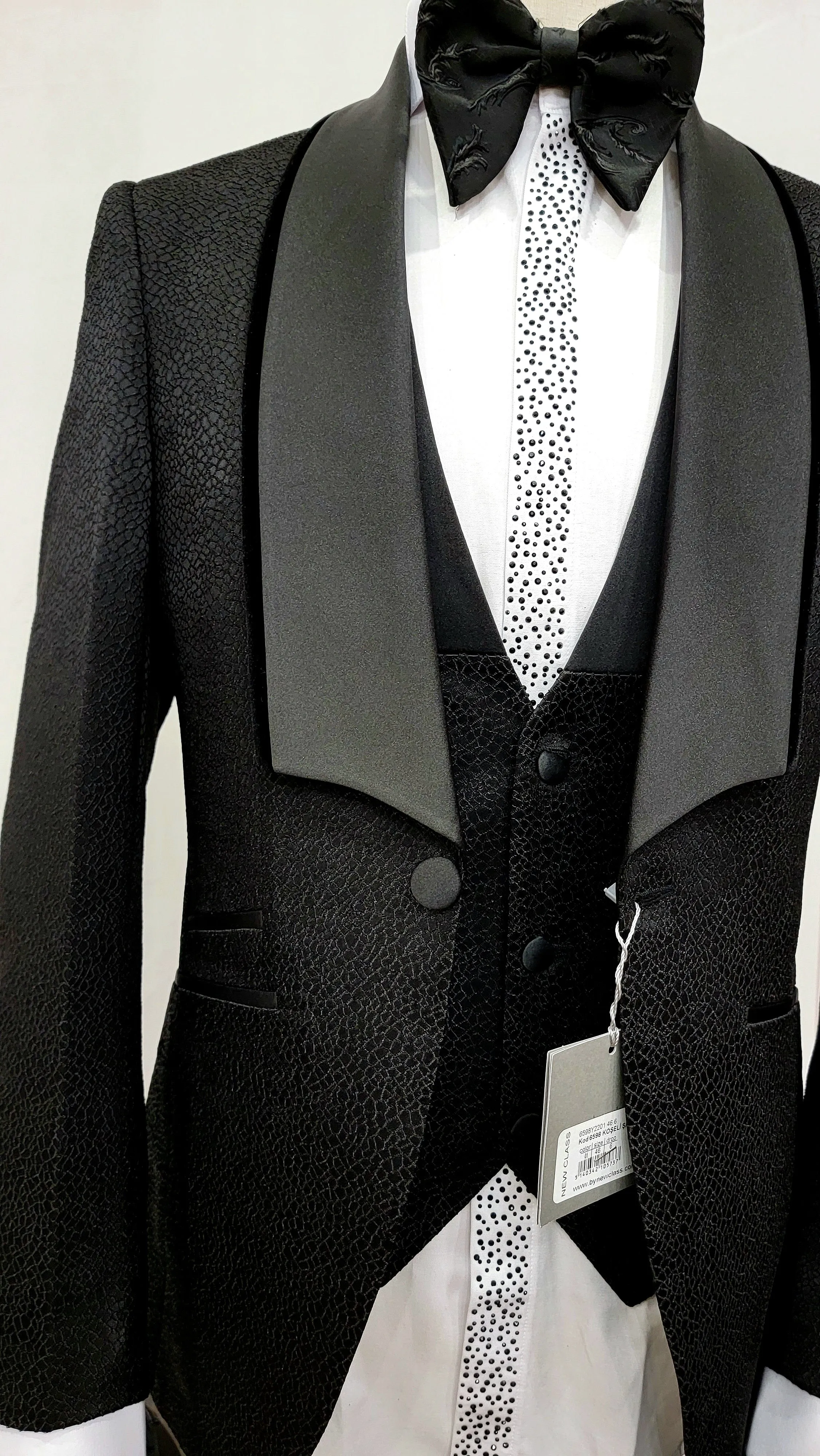 Three Piece Tuxedo Suit with Black velvet accented Lapel and Pants.