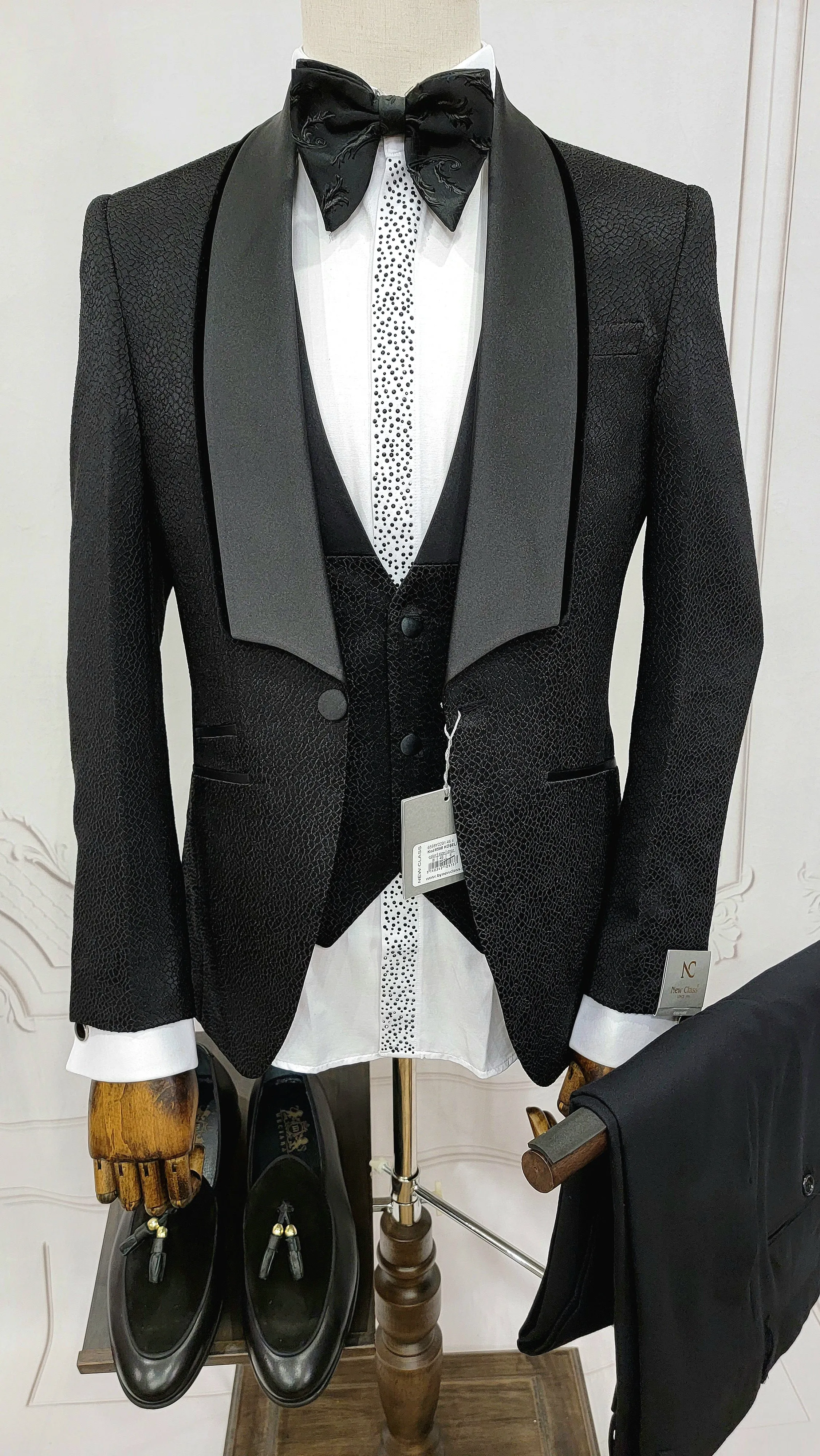 Three Piece Tuxedo Suit with Black velvet accented Lapel and Pants.