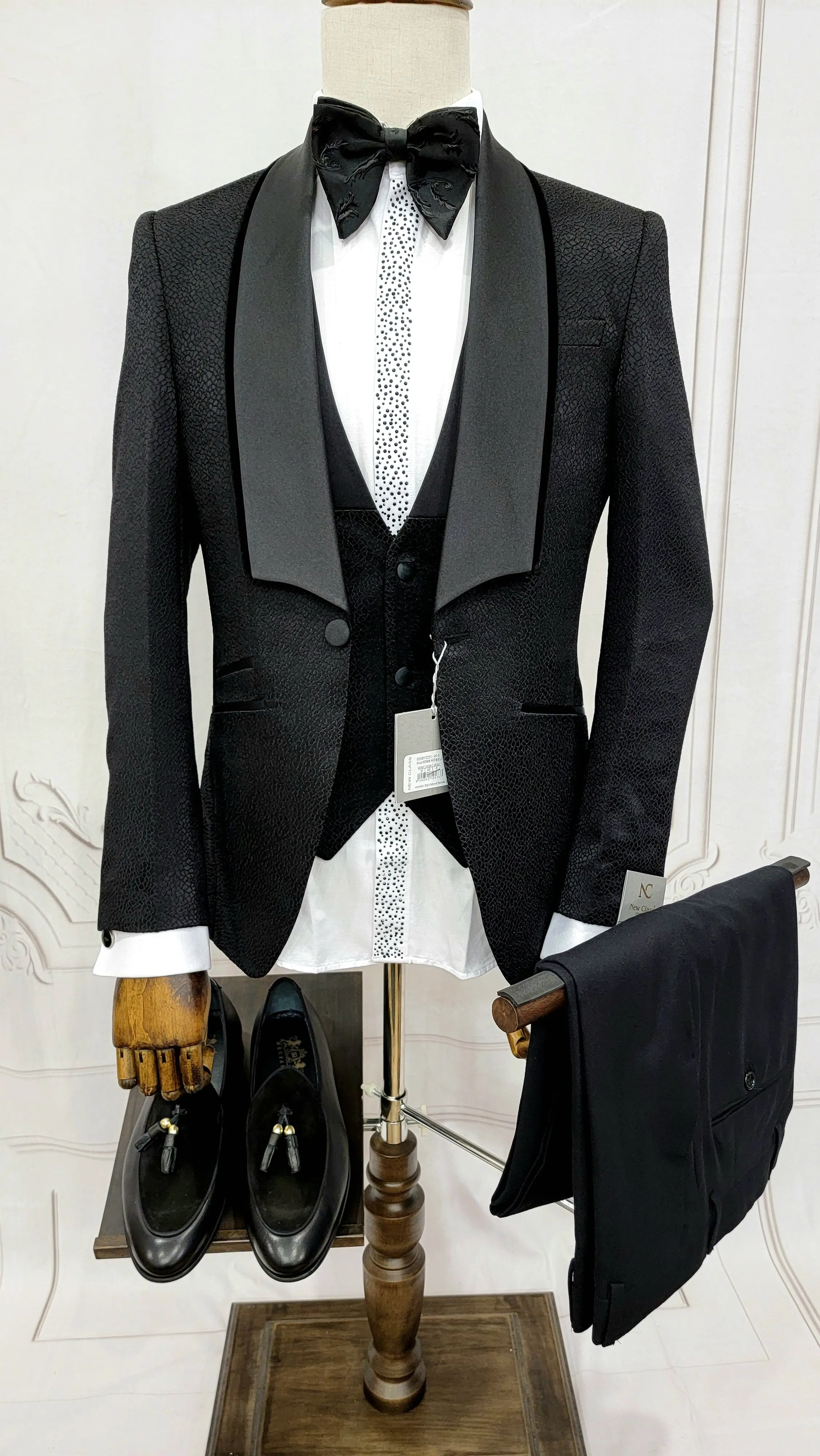 Three Piece Tuxedo Suit with Black velvet accented Lapel and Pants.