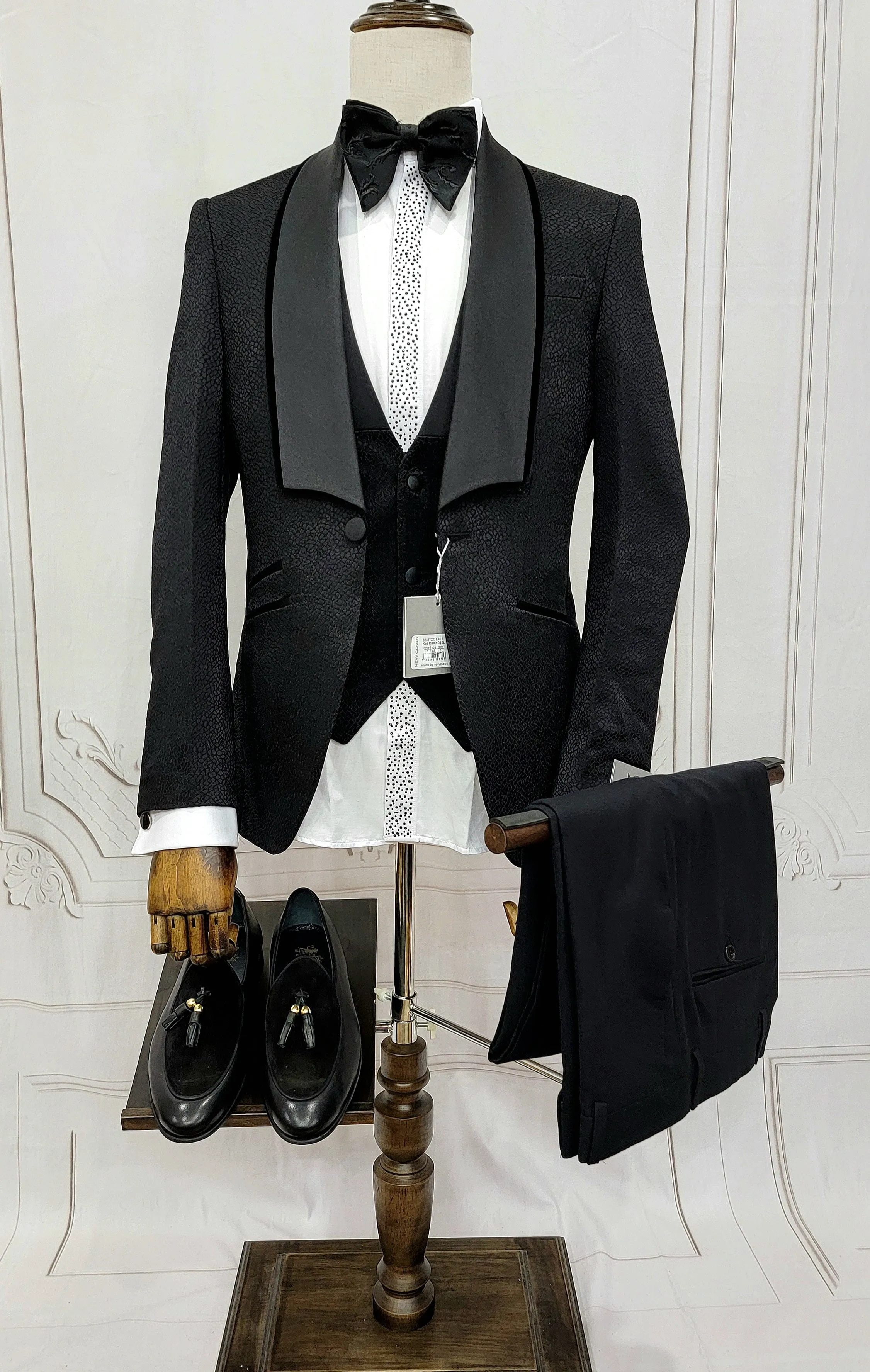 Three Piece Tuxedo Suit with Black velvet accented Lapel and Pants.