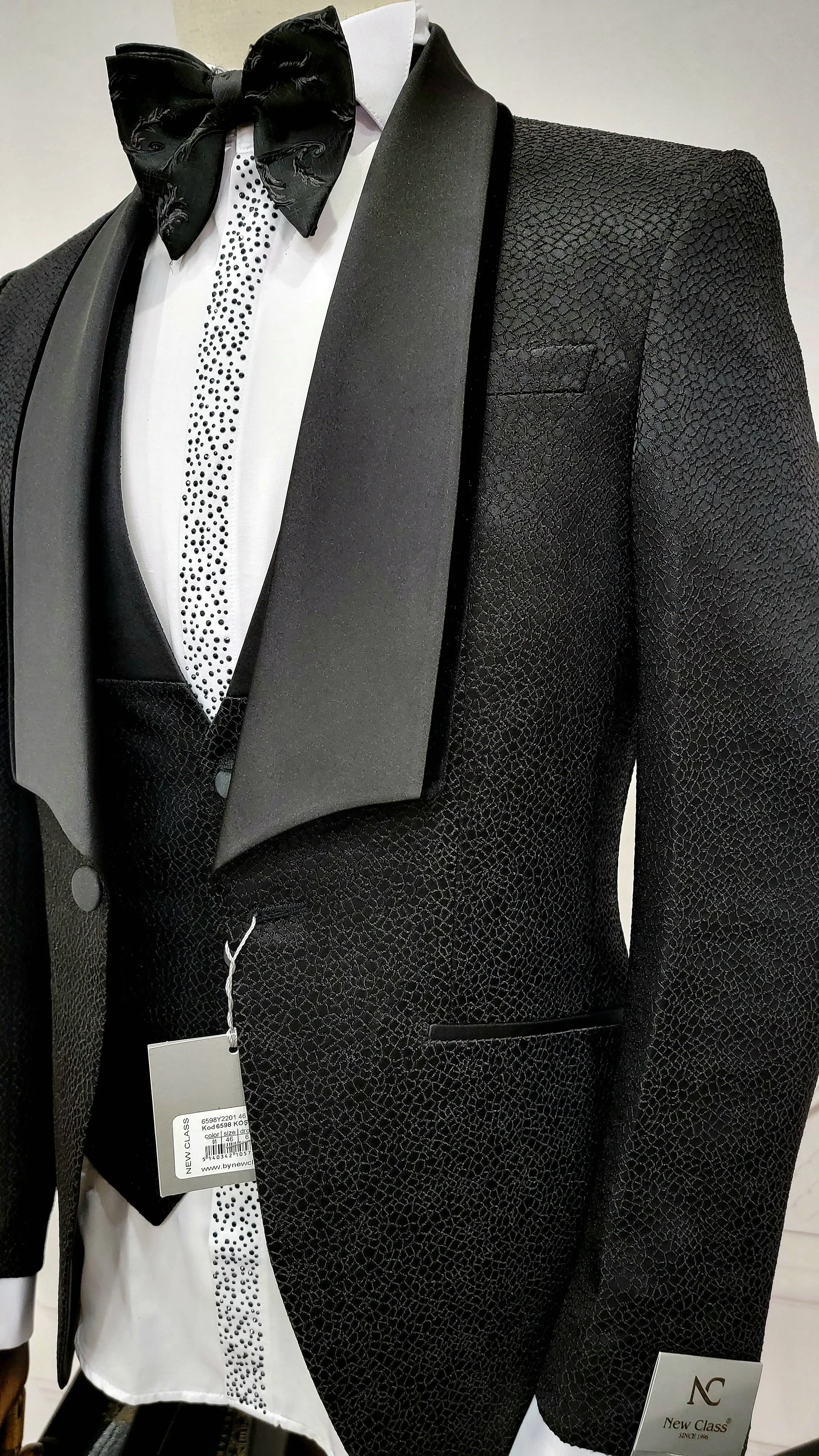 Three Piece Tuxedo Suit with Black velvet accented Lapel and Pants.